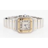*A bi-metal Cartier Santos quartz wrist watch, the champagne tone dial having hourly Roman numeral