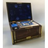 A brass cased vanity box with blue velvet interior, marked MEC.