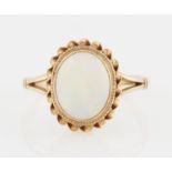 A 9ct yellow gold opal ring, set with a central oval opal cabochon, measuring approx. 10x8mm, with