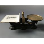 C.W. Bracknell Ltd brass weighing scales, with weights.