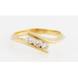 An 18ct yellow gold three stone diamond ring, bar set with three round brilliant cut diamonds in