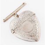 A Victorian silver heart shaped vesta case, hallmarked Birmingham 1897, with attached brooch