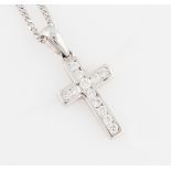 A diamond set cross pendant, indistinctly marked, on an 18ct white gold curb link chain,