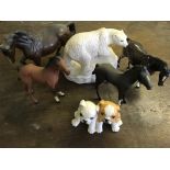 Four Doulton horses, Royal Doulton polar bear and Royal Doulton bulldog pups.