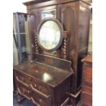 An oak two piece bedroom suite comprising of a mirror single door wardrobe and one dressing table.