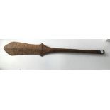 A tribal art Australasian incised club/ paddle
