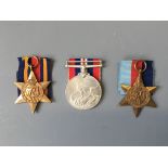 Three medals awarded in recognition of service in the war of 1939-45: a 1939-45 Star, a 1939-45