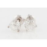 A pair of diamond stud earrings, each set with a Crown of Light cut diamond, measuring approx. 0.