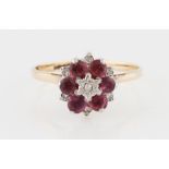 A ruby and diamond flower design cluster ring, hallmark indistinct, ring size R.
