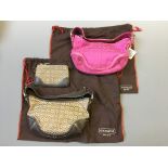 Two Coach signature small hobo bags, one hot pink suede trimmed with label, one brown leather