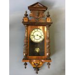 A Vienna style mahogany wall clock.