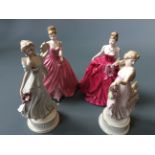 Two Wedgwood figurines from the 'The Dancing Hours' floral collection together with two Coalport