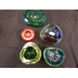 Five studio glass ashtrays, one with milleflori decoration.