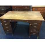 An oak nine drawer desk.