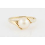 A pearl ring, stamped 10k, ring size L½, weight approx. 1.9g.