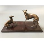 Two bronze whippet figurines mounted on wood. AF.