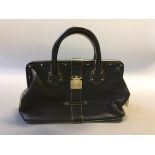 A Louis Vuitton black leather yellow stitched handbag with sack.