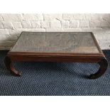 A glazed top squat coffee table with Japanese design.