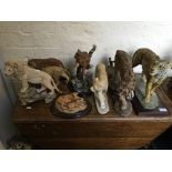A selection of resin figurines to include tigers, lions and a lynx.