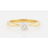 An 18ct yellow gold diamond solitaire ring, set with a round brilliant cut diamond, measuring