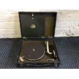 A His Masters Voice record player in black case.