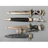 Two German style daggers with scabbards, both engraved and marked RZM M7/36.