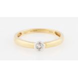 An 18ct yellow gold diamond solitaire, bezel set with a round brilliant cut diamond, measuring