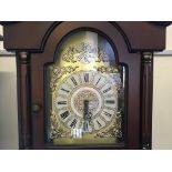 A Tempus Fugit reproduction mahogany grandfather clock.