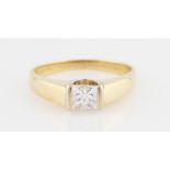 A diamond solitaire ring, set with a princess cut diamond, measuring 0.59ct, to raised shoulders,