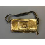 A Tanner Krolle metallic gold handbag.