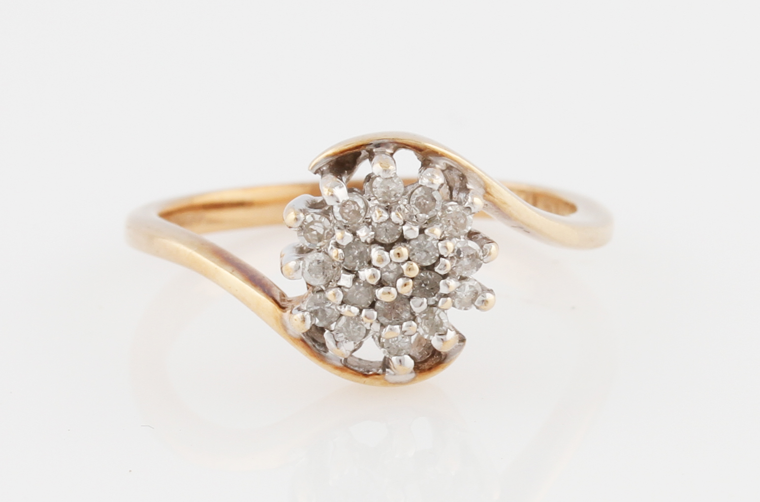 A 9ct yellow gold diamond flower design cluster ring, hallmarked Birmingham, ring size N.