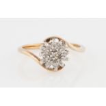 A 9ct yellow gold diamond flower design cluster ring, hallmarked Birmingham, ring size N.