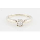 A 9ct white gold diamond solitaire ring, illusion set with a round brilliant cut diamond,