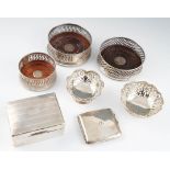A collection of hallmarked silverware, to include three wine coasters, two pierced dishes, a