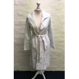 A Jean Muir white collared coat with belt.