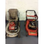 A Honda and Briggs & Stratton petrol lawnmowers.