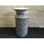 A blue, green and gold decorated vase with Arabic writing to base. Height 40cm.