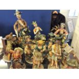 A collection of Capo di Monte style figurines.