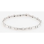 An 18ct white gold diamond line bracelet, set with round brilliant cut diamonds to circular links,