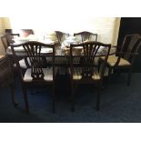 *A reproduction mahogany dining table with six chairs.