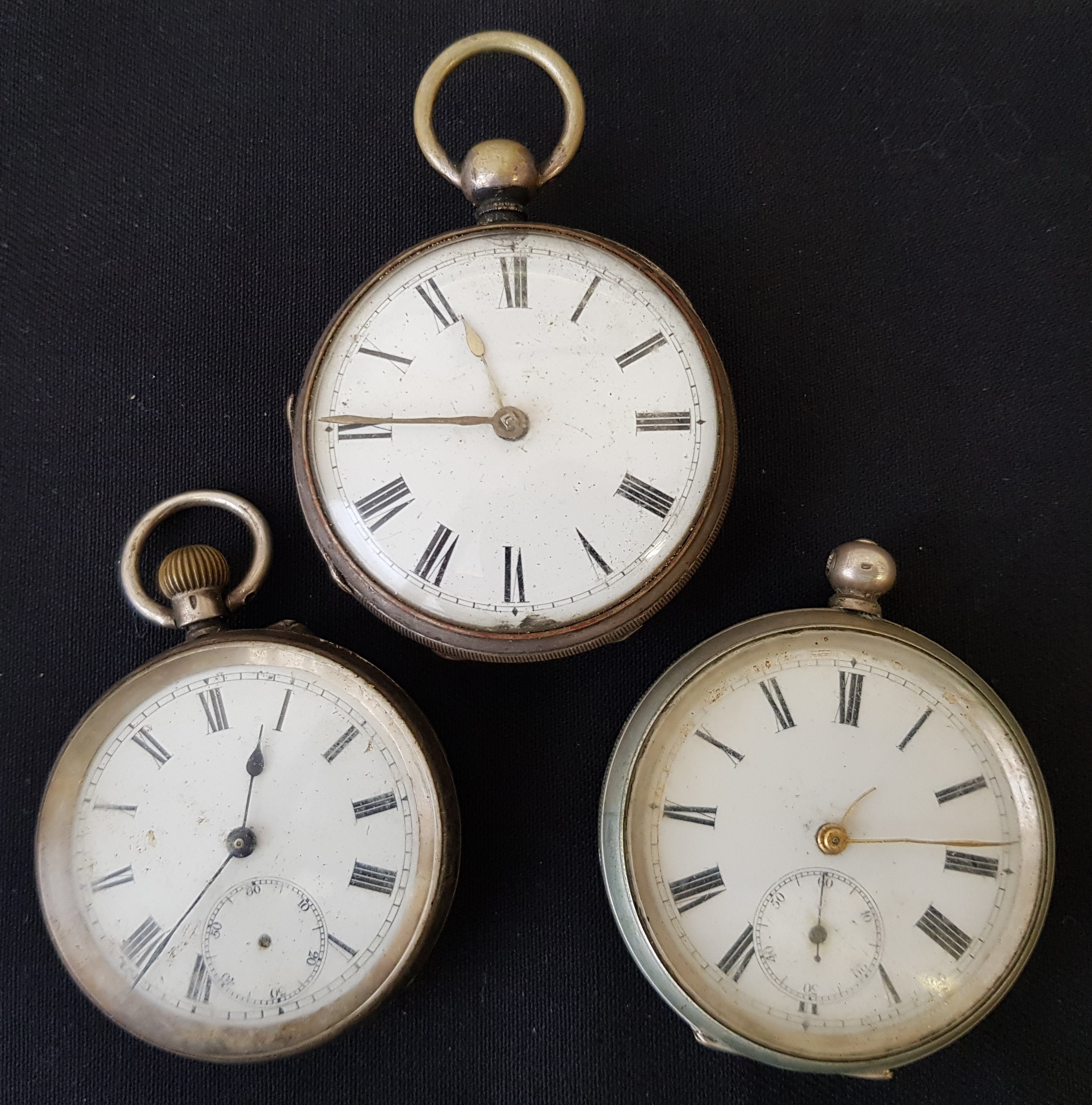 A collection of three pocket watches, one stamped 0,935, one 0.800, the other indistinctly