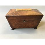 *A mahogany sarcophagus shaped tea caddy.