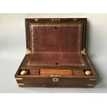*A rosewood writing desk with leather insert and plaque inscribed HH. A/F.