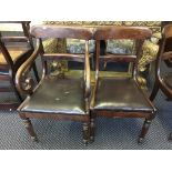 Five 19th Century mahogany dining chairs with a scroll arm carver.