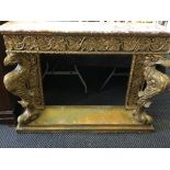 A marble topped console table with carved design.