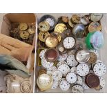 A large collection of pocket watch parts to include dials with attached movements, movements,