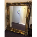 A large, gilt framed mirror, with damage to gilding, 120.5cm x 90cm.