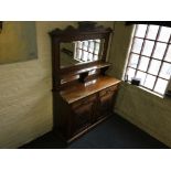 An Edwardian walnut mirror back dresser.