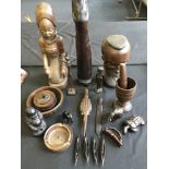 A selection of carved wooden items including African sculptures, salt dishes with spoons, pestle and