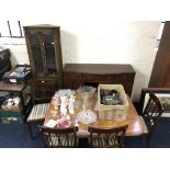 *A mahogany sideboard with four cupboards and three drawers, a mahogany table and chair set, and